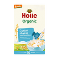 A box of Demeter Holle Organic Junior Muesli with Cornflakes, designed for children from 10 months. The packaging features a cream-colored background with red and green text, a blue elephant character, and an illustration of a bowl of cereal with milk splashes.