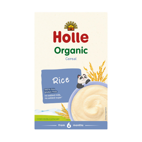 A package of Holle Organic Cereal Rice, designed for babies from 6 months old. The packaging features a cream-colored background with the Holle brand logo in red and green, a blue label, and an illustration of a bowl of rice with a panda character.