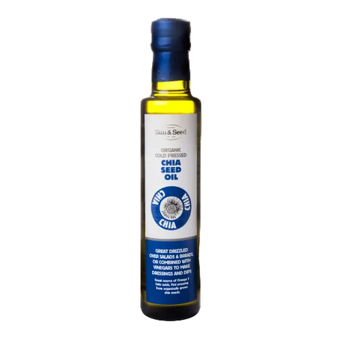 A bottle of Sun & Seed Organic Chia Seed Oil-Cold Pressed with a blue cap and a label indicating it is USDA Organic certified.
